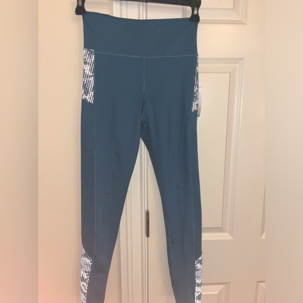 GoLite size small leggings NWT. Cell phone pocket, small zip pocket in back.